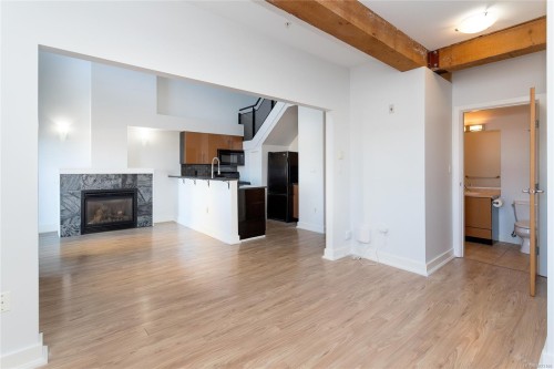 323-599 Pandora Ave, Victoria, BC - Indoor Photo Showing Other Room With Fireplace