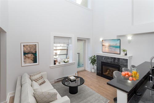 323-599 Pandora Ave, Victoria, BC - Indoor Photo Showing Other Room With Fireplace