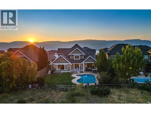 Amazing outdoor living overlooking protected parkland...pool, hot tub & covered lounge area. - 425 Audubon Court, Kelowna, BC - Outdoor With In Ground Pool With View