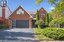 View of front facade featuring brick siding, a garage, and driveway - 599 Beechwood Drive, Waterloo, ON  - Outdoor 