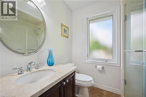 Bathroom featuring a stall shower, vanity, and dark tile patterned flooring - 599 Beechwood Drive, Waterloo, ON - Indoor Photo Showing Bathroom