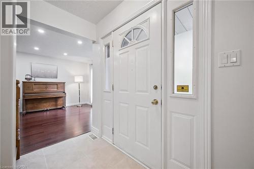 Entryway with light tile patterned floors and recessed lighting - 599 Beechwood Drive, Waterloo, ON - Indoor Photo Showing Other Room