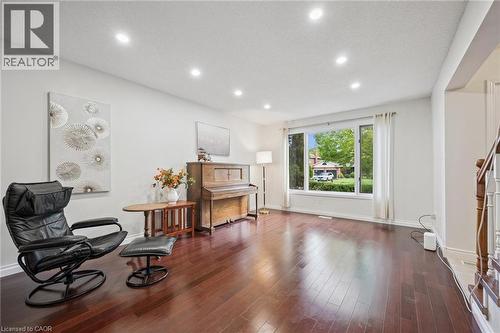 Sitting room featuring dark wood-style flooring and recessed lighting - 599 Beechwood Drive, Waterloo, ON - Indoor Photo Showing Other Room