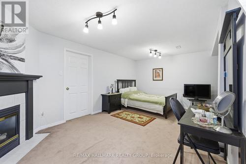 142 Inverkip Avenue, Ottawa, ON - Indoor Photo Showing Bedroom With Fireplace