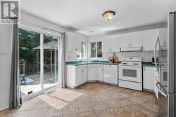 KITCHEN WITH DOUBLE SLIDING DOORS TO BACKYARD - 