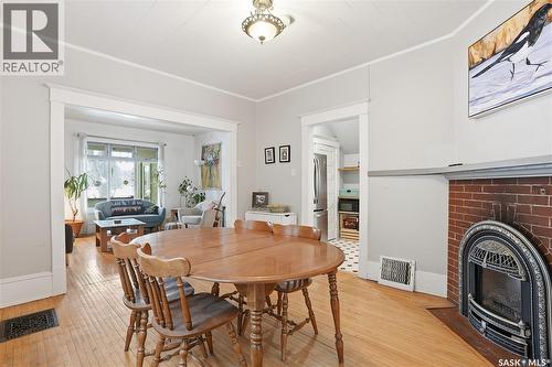 613 Dufferin Avenue, Saskatoon, SK - Indoor Photo Showing Dining Room With Fireplace