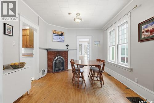 613 Dufferin Avenue, Saskatoon, SK - Indoor Photo Showing Dining Room With Fireplace