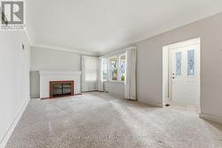 Living room with wood burning fireplace - 