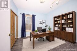 Room virtually staged as potential office. - 