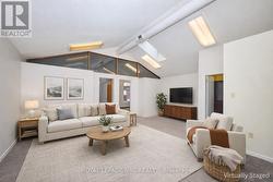 Virtually staged second floor living room. - 