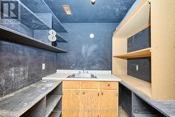 Wet bar area with shelving. - 