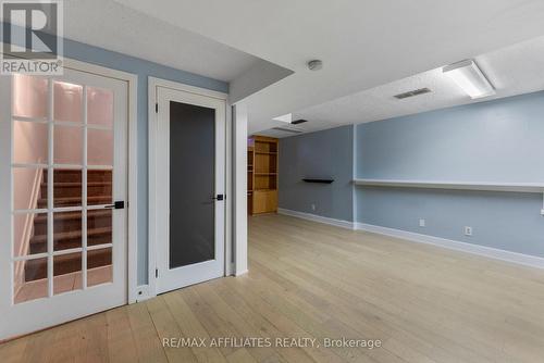 Lower level with french door for noise barrier.... - 31 Exeter Drive, Ottawa, ON - Indoor Photo Showing Other Room