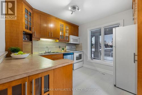 Ample cupboards & built in pantry. - 31 Exeter Drive, Ottawa, ON - Indoor Photo Showing Kitchen With Double Sink