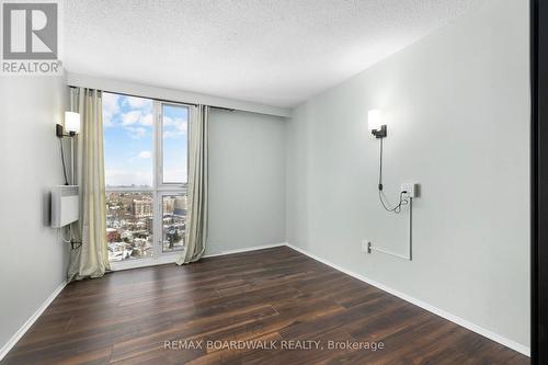 Double doors open to secondary bedroom - 2305 - 1025 Richmond Road, Ottawa, ON - Indoor Photo Showing Other Room