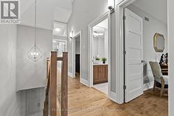 SECOND FLOOR HALLWAY WITH VAULTED CEILING. - 