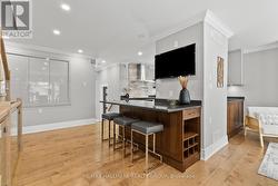 The breakfast bar is perfect for entertaining! - 