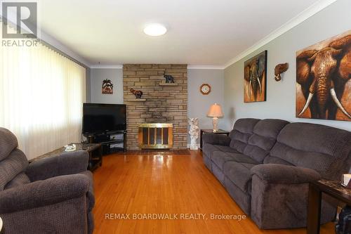 7032 Mason Street, Ottawa, ON - Indoor Photo Showing Living Room With Fireplace