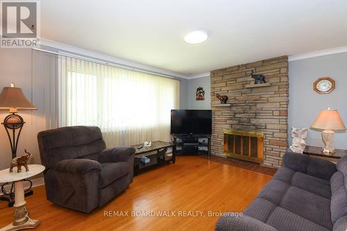 7032 Mason Street, Ottawa, ON - Indoor Photo Showing Living Room With Fireplace