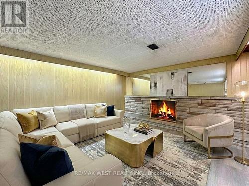 4 Kitson Drive, Toronto, ON - Indoor Photo Showing Living Room With Fireplace