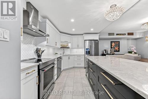 Marble backsplash, ceramic tile, pot lighting! - 1101 - 160 George Street, Ottawa, ON - Indoor Photo Showing Kitchen With Stainless Steel Kitchen With Upgraded Kitchen