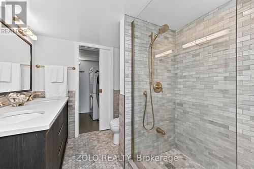 Full 4 piece bathroom with laundry/storage beyond. - 1101 - 160 George Street, Ottawa, ON - Indoor Photo Showing Bathroom
