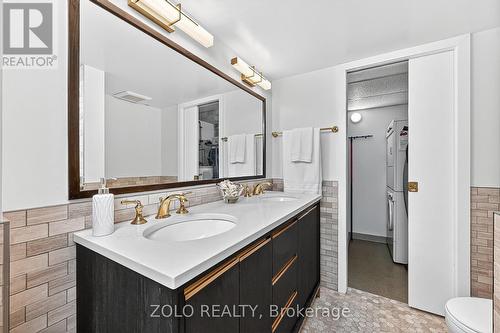 Double sinks, modern lighting and vanity. - 1101 - 160 George Street, Ottawa, ON - Indoor Photo Showing Bathroom