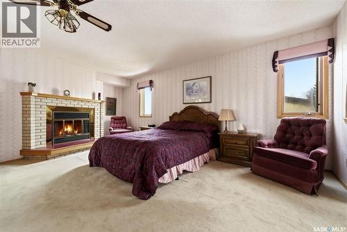 250 Prospect Crescent, Lumsden, SK - Indoor Photo Showing Bedroom With Fireplace