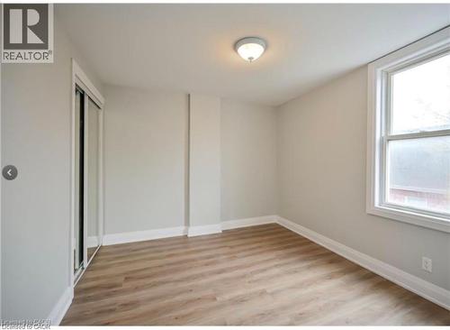 Empty room with light wood-type flooring and baseboards - 1024 Cannon Street E, Hamilton, ON - Indoor Photo Showing Other Room