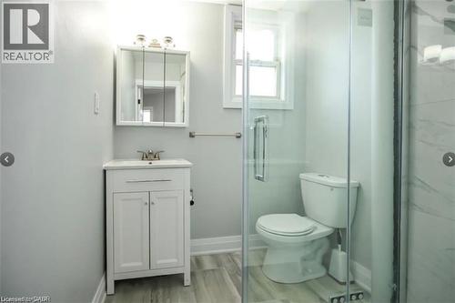 Bathroom featuring vanity, a stall shower, and light wood-style flooring - 1024 Cannon Street E, Hamilton, ON - Indoor Photo Showing Bathroom
