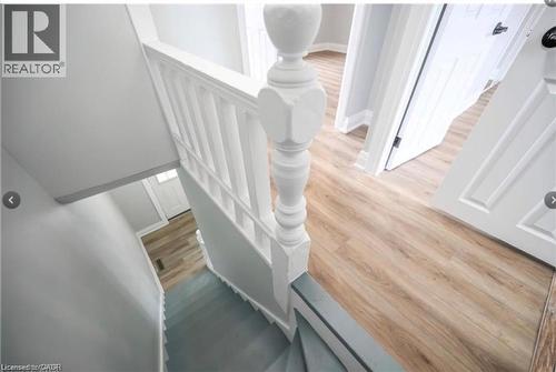 Stairway with wood finished floors and baseboards - 1024 Cannon Street E, Hamilton, ON - Indoor Photo Showing Other Room