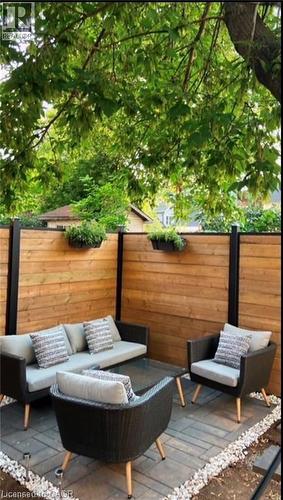 Deck with outdoor lounge area, a fenced backyard, and a patio area - 1024 Cannon Street E, Hamilton, ON - Outdoor With Deck Patio Veranda