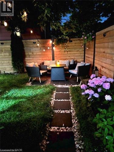 Fenced backyard with an outdoor living space and a patio area - 1024 Cannon Street E, Hamilton, ON - Outdoor