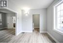Spare room with light wood-style flooring and baseboards - 1024 Cannon Street E, Hamilton, ON  - Indoor Photo Showing Other Room 