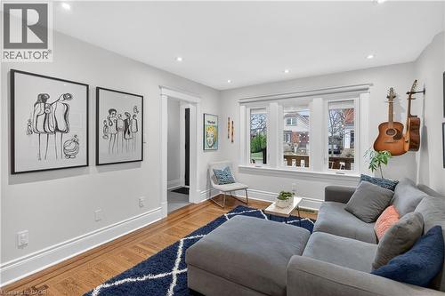 Living area with wood finished floors and recessed lighting - 248 London Street S, Hamilton, ON - Indoor Photo Showing Living Room