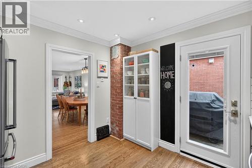 Doorway to outside with ornamental molding, wood finished floors, and recessed lighting - 248 London Street S, Hamilton, ON - Indoor Photo Showing Other Room