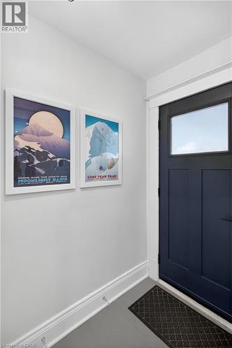 Entrance foyer featuring baseboards and tile patterned flooring - 248 London Street S, Hamilton, ON - Indoor Photo Showing Other Room