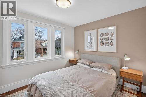 Bedroom featuring baseboards and wood finished floors - 248 London Street S, Hamilton, ON - Indoor Photo Showing Bedroom
