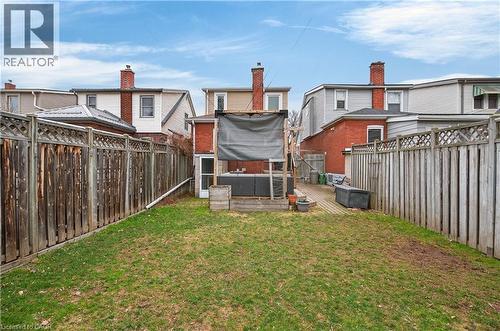 Fenced backyard with a wooden deck - 248 London Street S, Hamilton, ON - Outdoor With Deck Patio Veranda