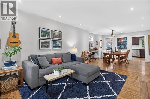 Living area featuring light wood-style floors and a chandelier - 248 London Street S, Hamilton, ON - Indoor Photo Showing Living Room
