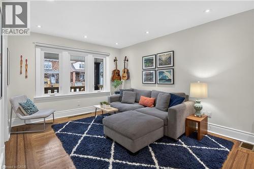 Living area featuring wood finished floors and recessed lighting - 248 London Street S, Hamilton, ON - Indoor Photo Showing Living Room