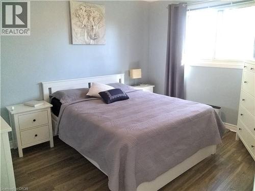 Bedroom with dark wood-style flooring - 1492 Sandgate Crescent Unit# Upper, Mississauga, ON - Indoor Photo Showing Bedroom