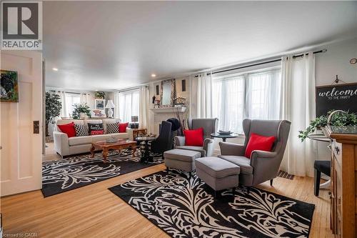 Note the many large windows to let the sun sdtream in. - 99 Argyle Street N, Caledonia, ON - Indoor Photo Showing Living Room