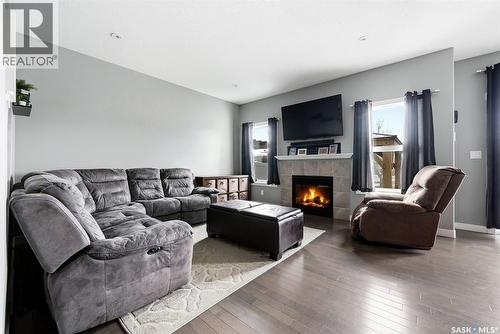 5343 Universal Crescent, Regina, SK - Indoor Photo Showing Living Room With Fireplace