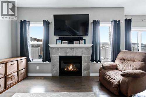 5343 Universal Crescent, Regina, SK - Indoor Photo Showing Living Room With Fireplace