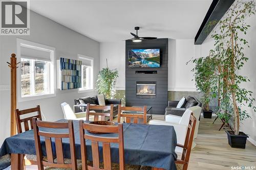 26 Alice Crescent, North Grove, SK - Indoor Photo Showing Dining Room With Fireplace