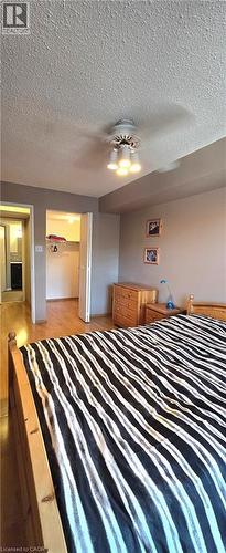 Primary Bedroom w/ Walk-in Closet - 175 E Hunter Street E Unit# 404, Hamilton, ON - Indoor Photo Showing Bedroom