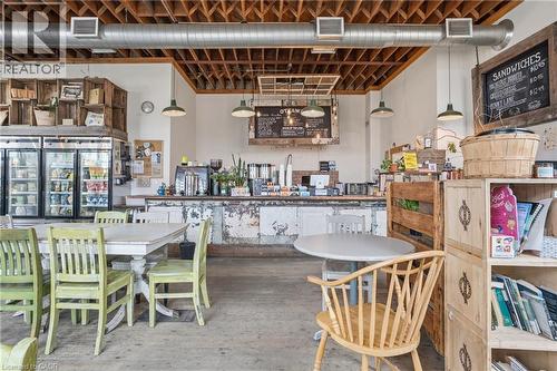 Dining room featuring wood finished floors - 204 Ottawa Street N, Hamilton, ON 