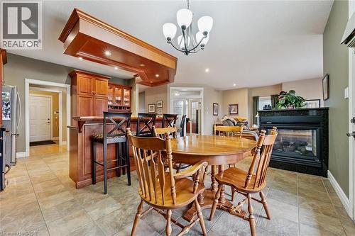 285 Deer Ridge Drive, Kitchener, ON - Indoor Photo Showing Dining Room With Fireplace