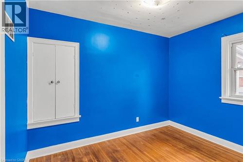 Unfurnished room with hardwood / wood-style flooring and baseboards - 41 Floral Crescent, Kitchener, ON - Indoor Photo Showing Other Room