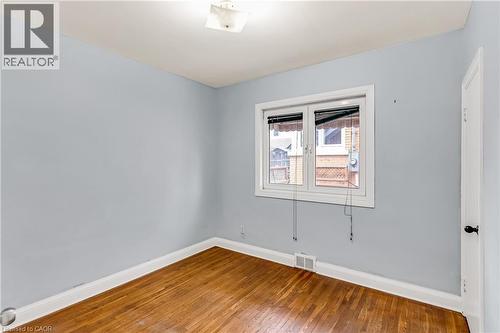 Unfurnished room with baseboards and hardwood / wood-style floors - 41 Floral Crescent, Kitchener, ON - Indoor Photo Showing Other Room